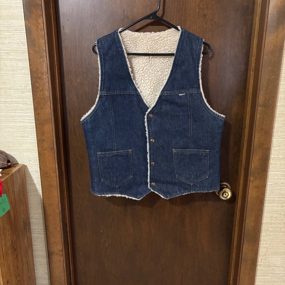 Classic blue vest with cozy sherpa lining.  Ideal for layering and comfort.